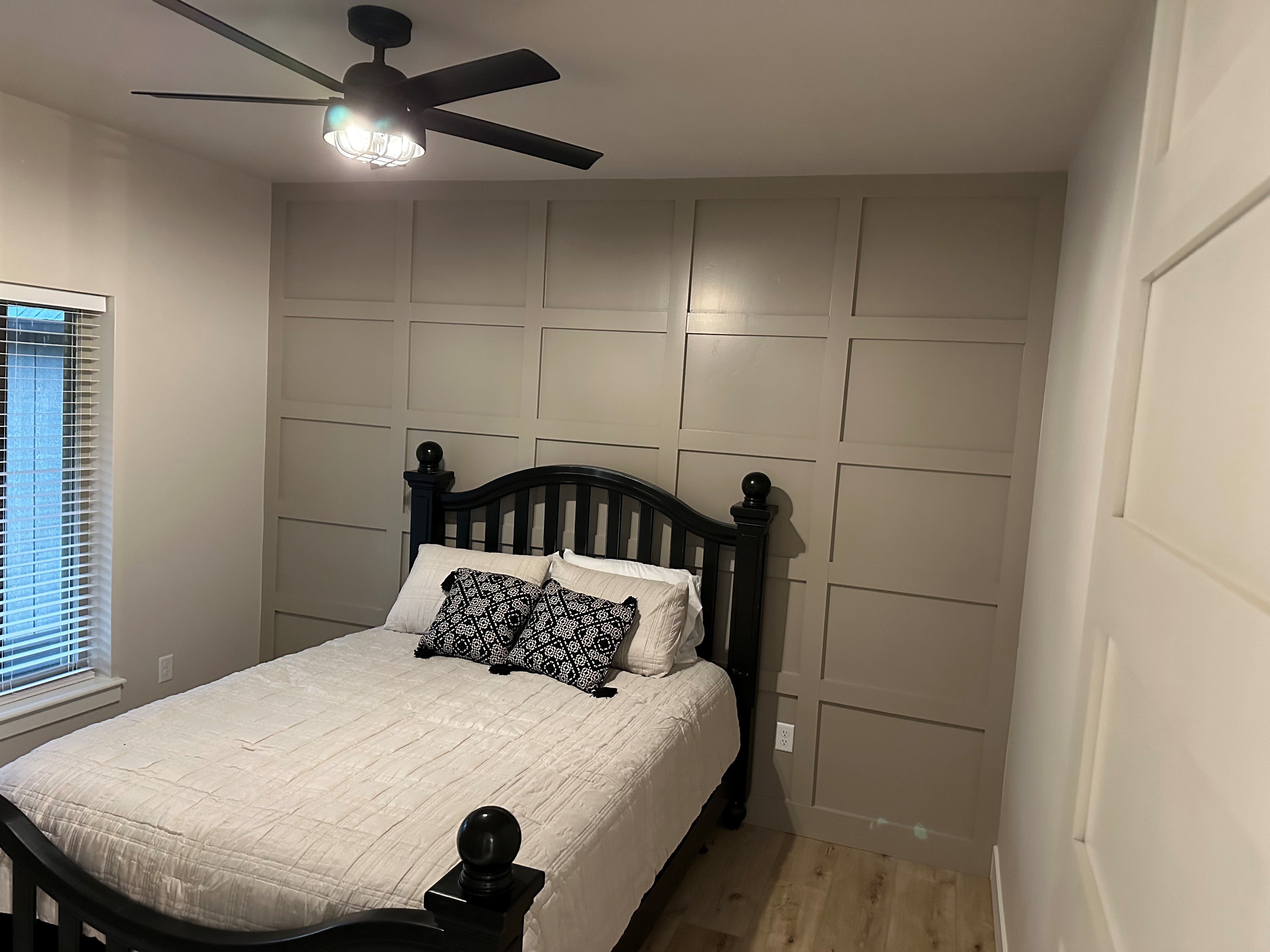 Bedroom upgrade with trim wall and ceiling fan